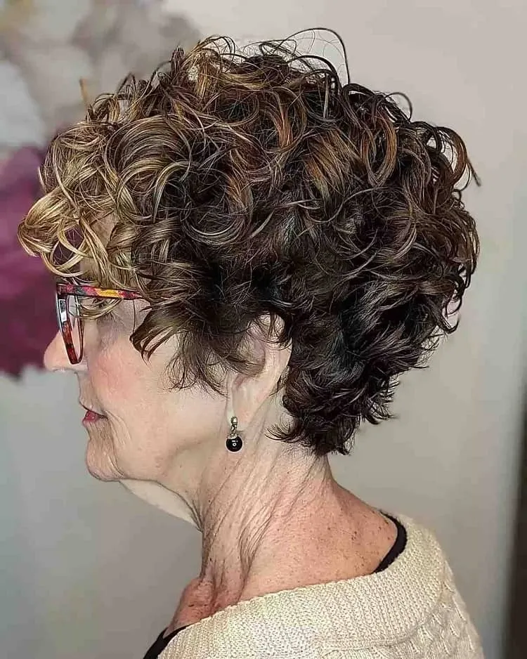 curled bixie brunette with blonde highlights over 60