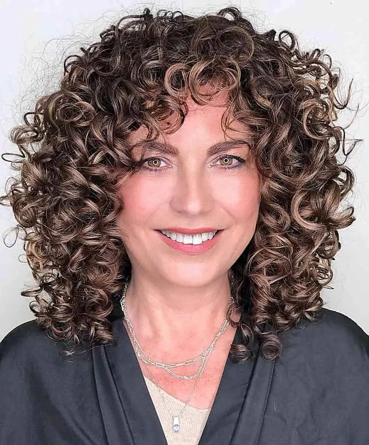 curly mid length hairstyles over 50 hairstyles medium length over 50 with curly hair