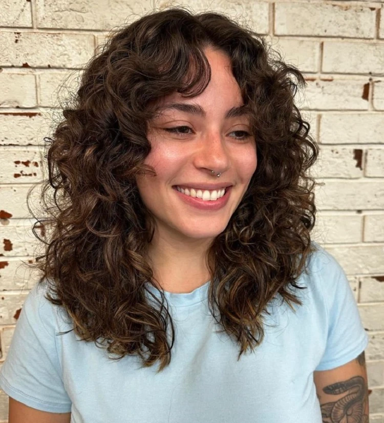 cute haircuts for women with curly hair and bangs