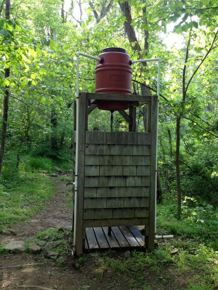 easy diy outdoor shower with plastic tube in its design