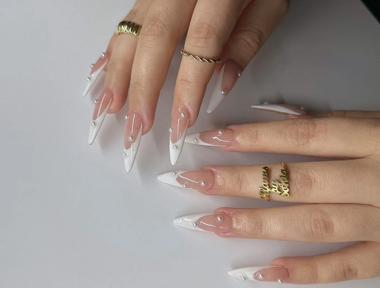 french tip nails with pearl decoration long stiletto shape