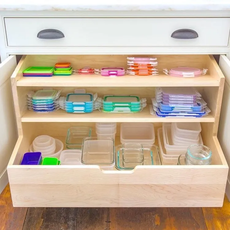 how to organize tupperware in cabinet pile similar containers together