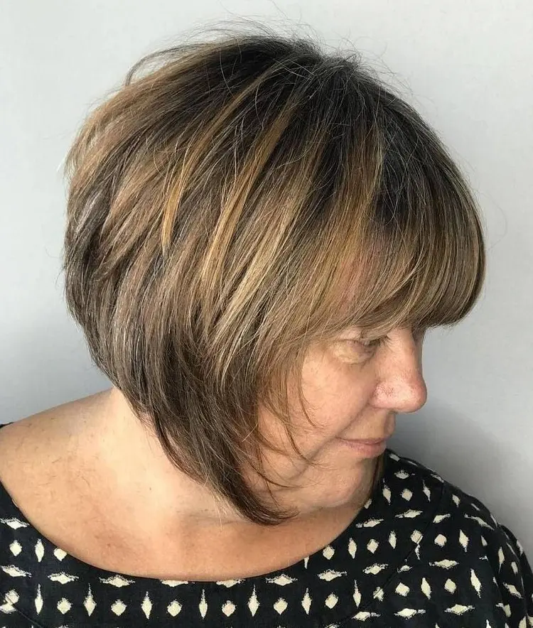 inverted stacked bob for women over 60 with bangs