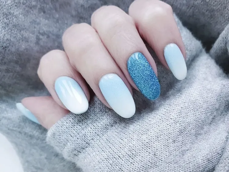 light blue nail design with glitter