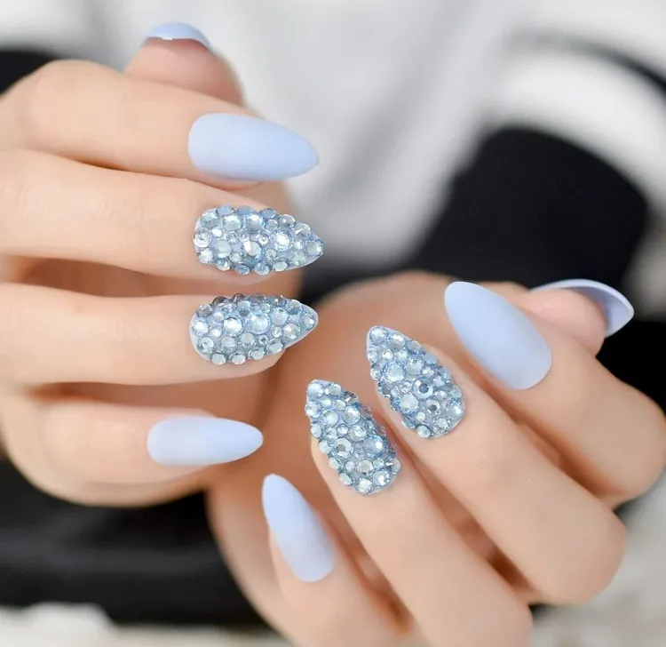 matte light blue nails with rhinestones