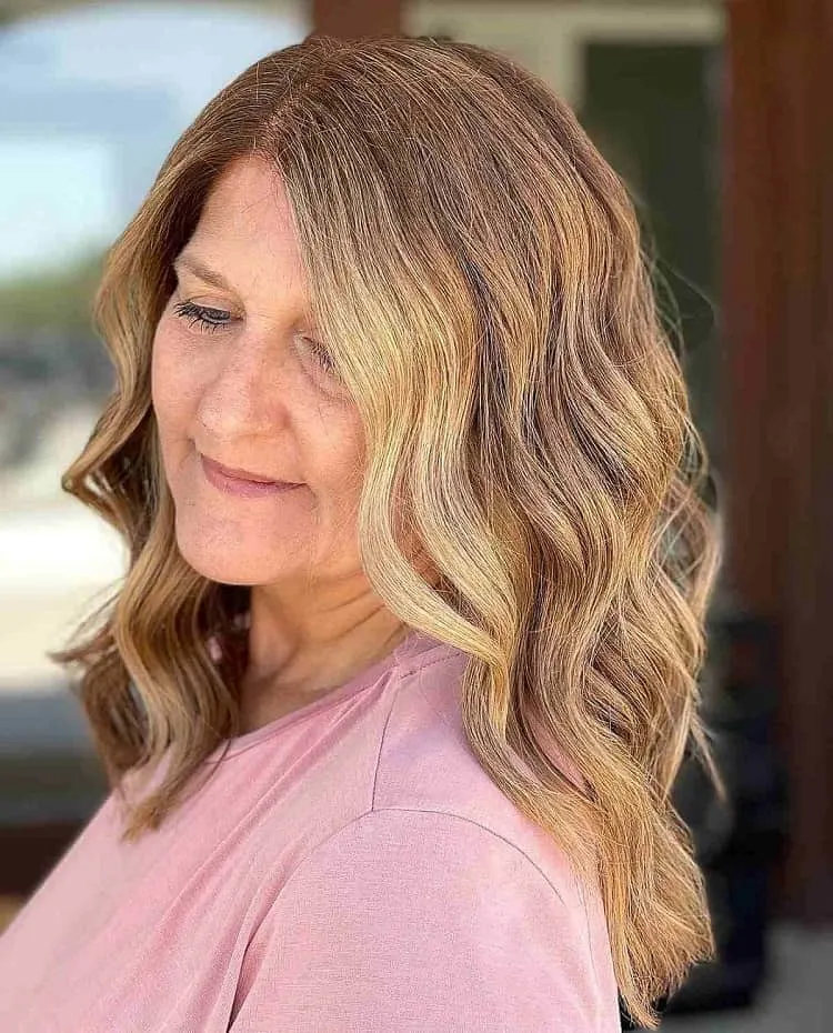 mid length blonde balayage for a women over 50 hairstyles medium length over 50