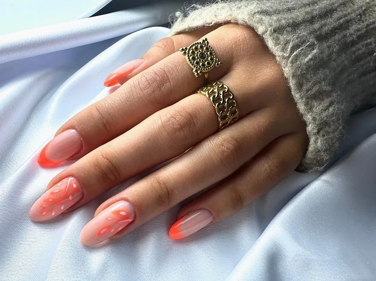orange french tip nails with decorations 2023