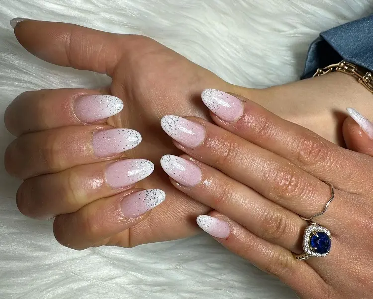 pink and white french ombre nails with glitter