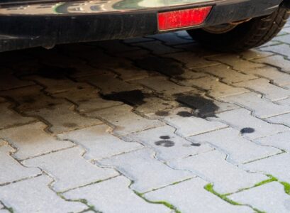 remove grease and oil stains from concrete cover with baking soda to absorb
