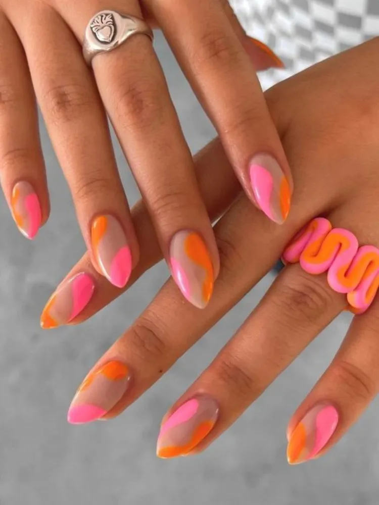 short stiletto summer acrylic nails pink orange color block squigles design