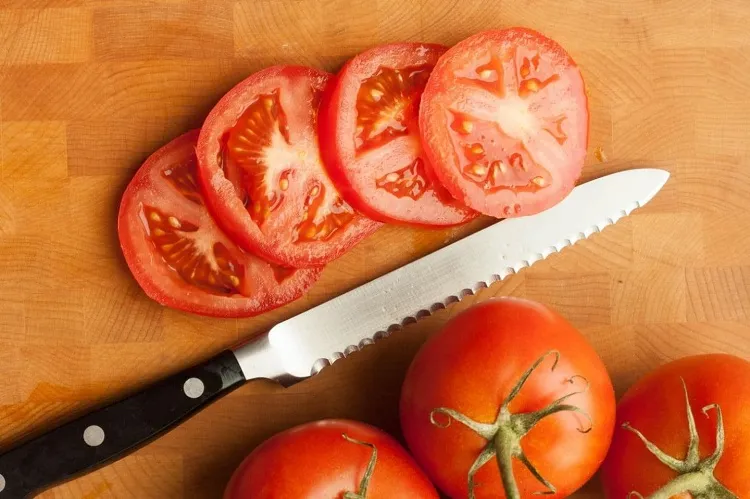 tomato cut how to cut tomatoes in thin slices a knife with sharp edge