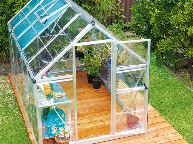 what are the benefits of building my own greenhouse in the backyard
