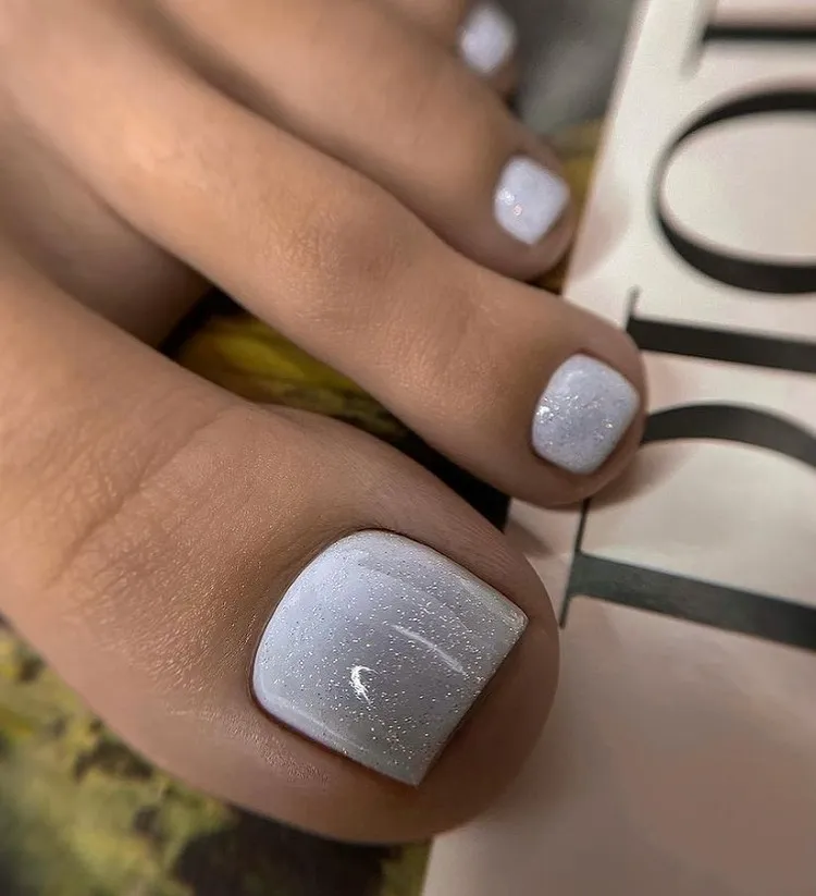 white nail polish silver glitter classy summer pedicure ideas 2023