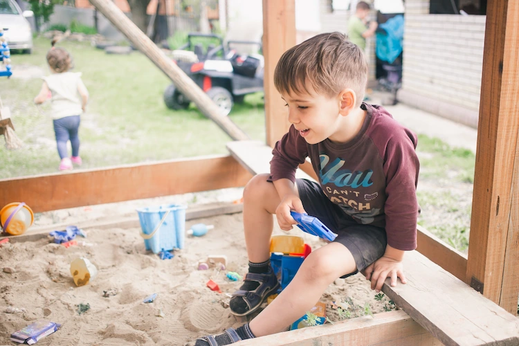 build a sandpit for children and equip with a seating area
