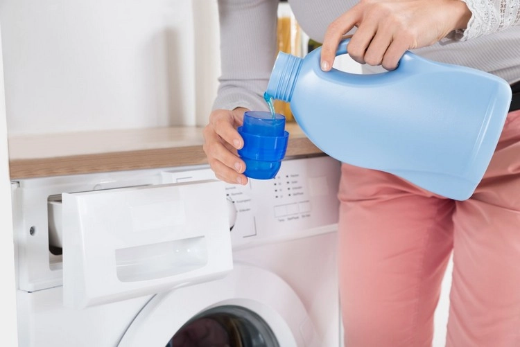 detergents can leave residues on clothing in which bacteria and thereby odors accumulate