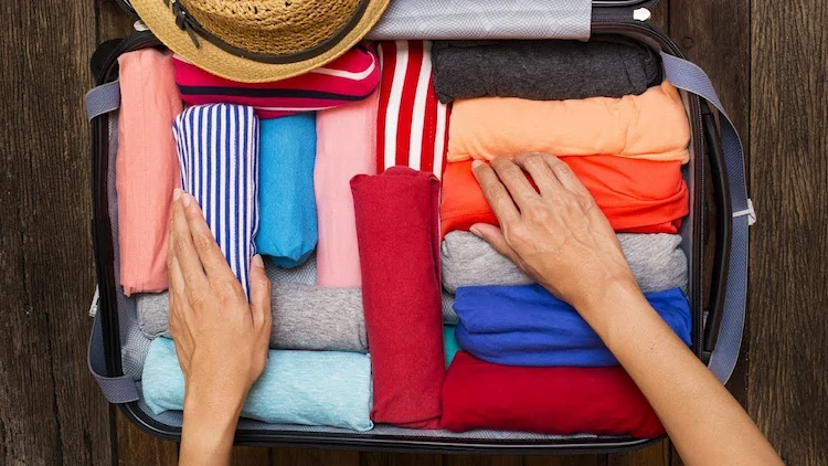 how to pack a suitcase roll your clothes instead of folding them