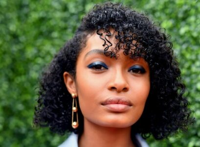 blunt structured bob wispy bangs curly hair oblong face
