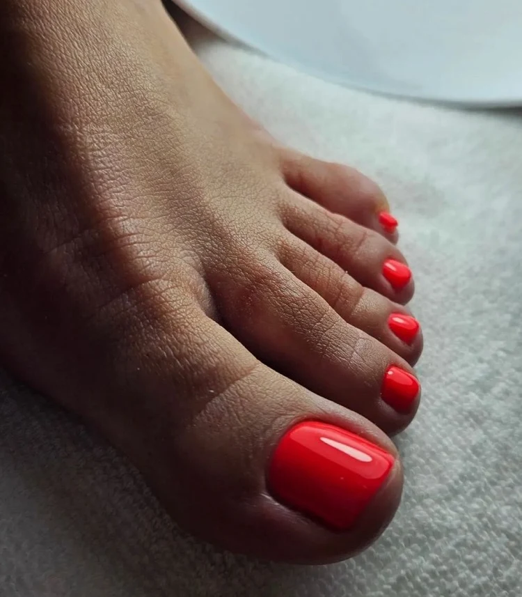 bright red summer toe nail design for dark skin