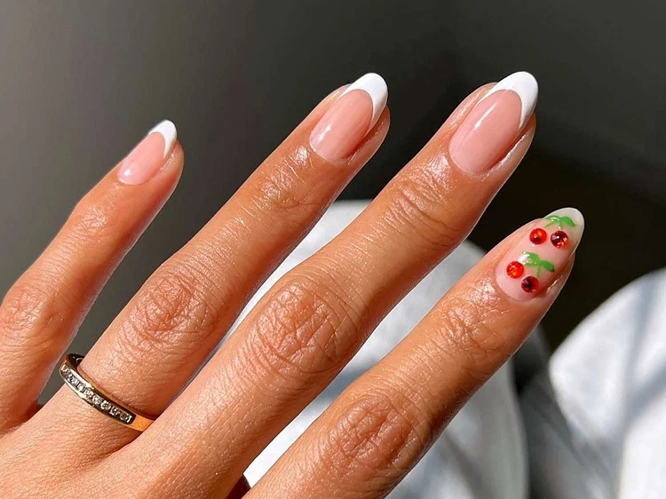 classic white french manicure with cherries 2023