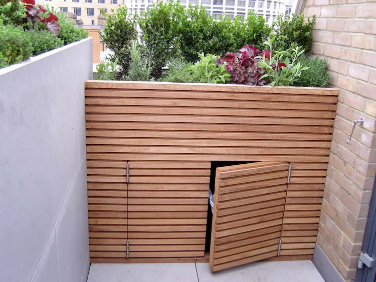 combine modern front yard design with garbage can cladding ideas