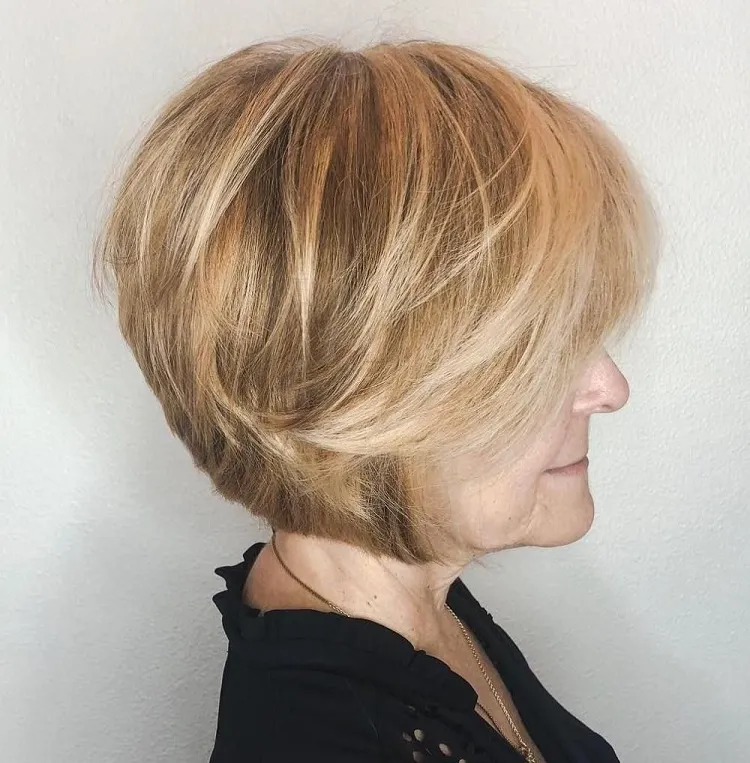feather layers bob haircut for women over 60 with bangs