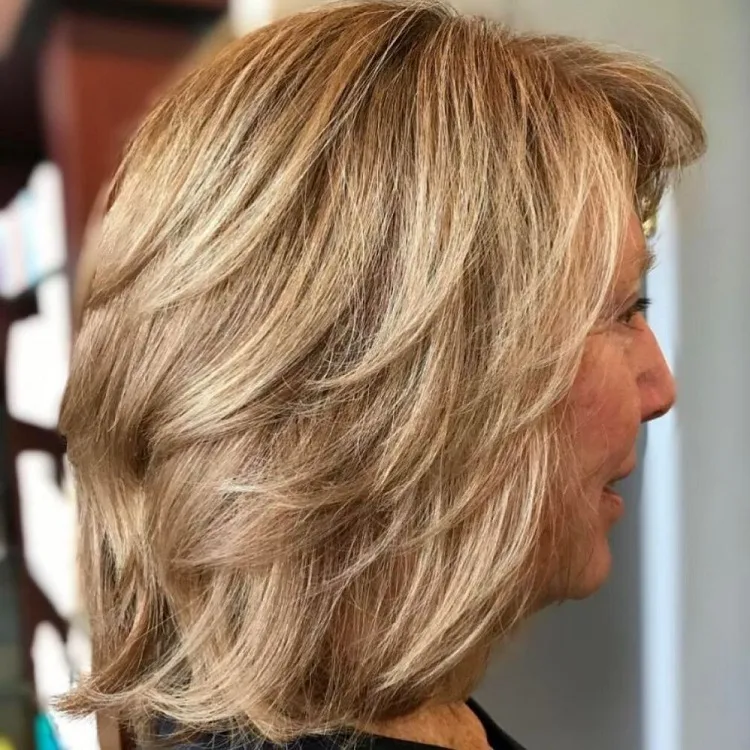 feather layers haircut for women over 60 with bangs lob hairstyle