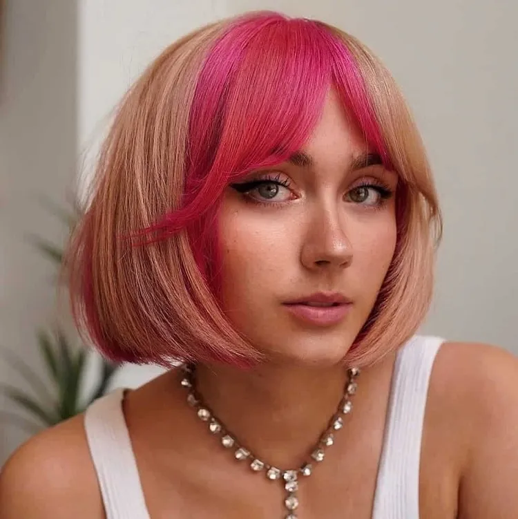 french bob haircut in pink yellow with bangs