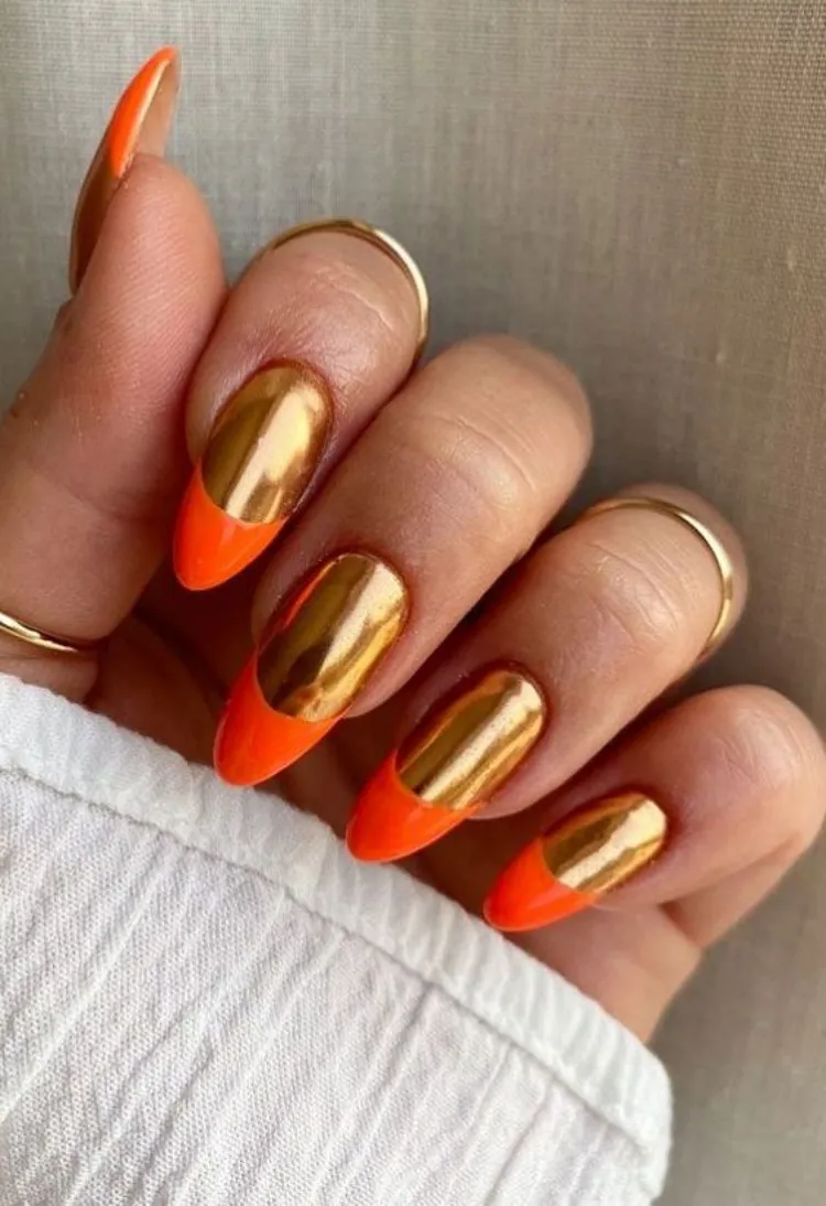 gold chrome nails neon orange french tips leo season manicure