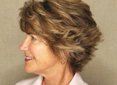 graduated bob haircut for women over 60 with piece y layers feathered