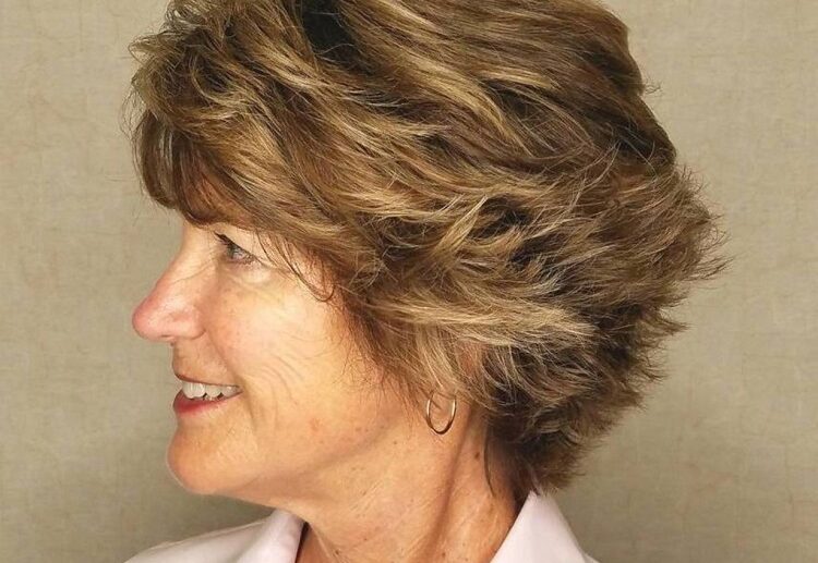 graduated bob haircut for women over 60 with piece y layers feathered