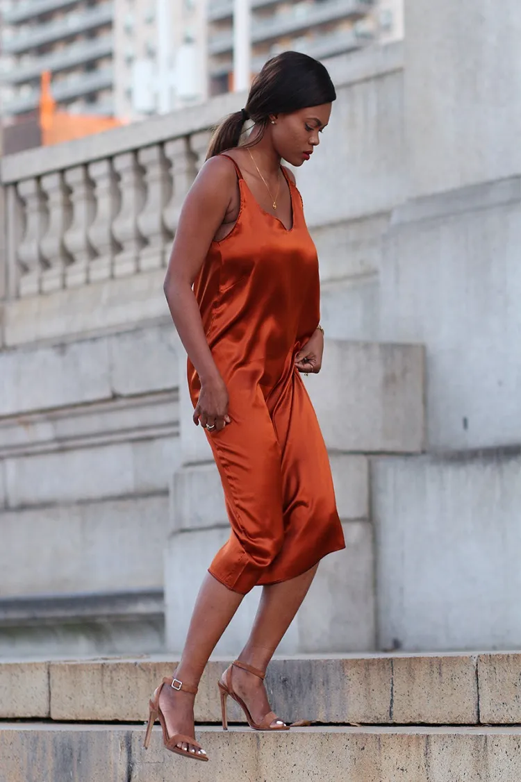 how to wear a midi satin dress at the office slip dress in rusty orange