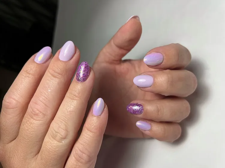 lavender chrome nails with purple glitter