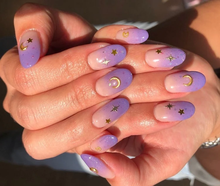 leo season nail ideas 2023 lavender ombre manicure with zodiac decoration oval shape