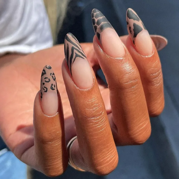 long oval nails mismatched animal print french tips brown skin summer manicure ideas 2023