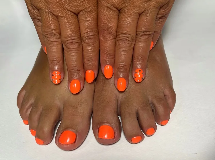 matching manicure and pedicure colors for women over 50 bright orange nails