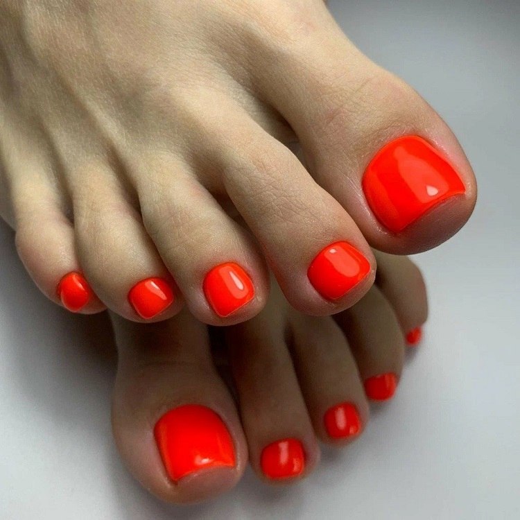 orange nail polish trendiest pedicure color summer 2023