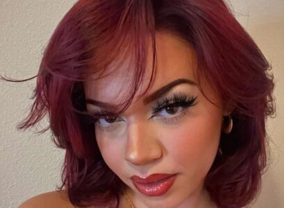 ruby red wavy short hair butterfly haircut side bangs oval face shape