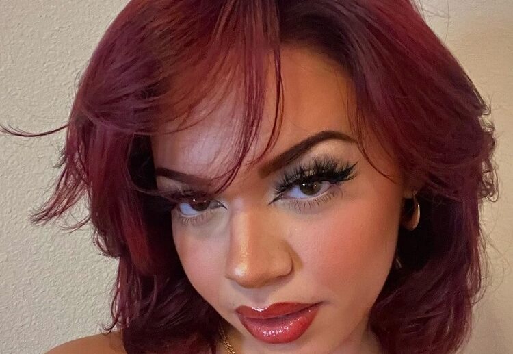 ruby red wavy short hair butterfly haircut side bangs oval face shape