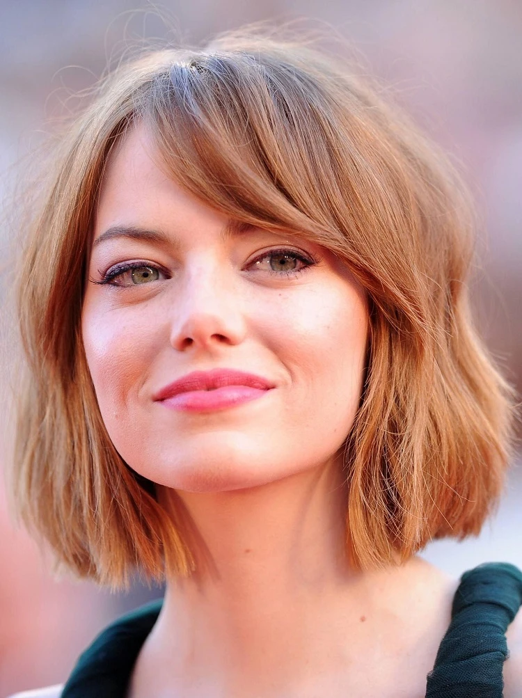 short blunt bob haircut with side swept bangs with waves