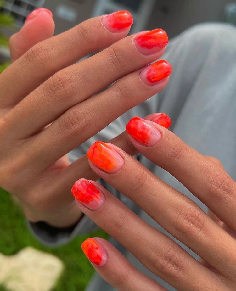 short orange abstract nails classy manicure ideas summer 2023