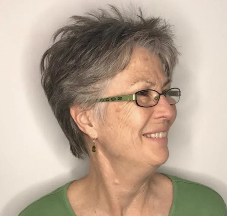short wispy pixie haircut for women over 60 with glasses grey hair