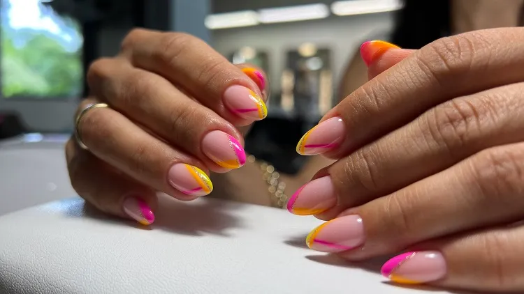 summer french tip nails design with pink and orange