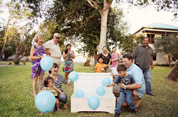 summer gender reveal party ideas a blue baloon for a boy a pink for a girl