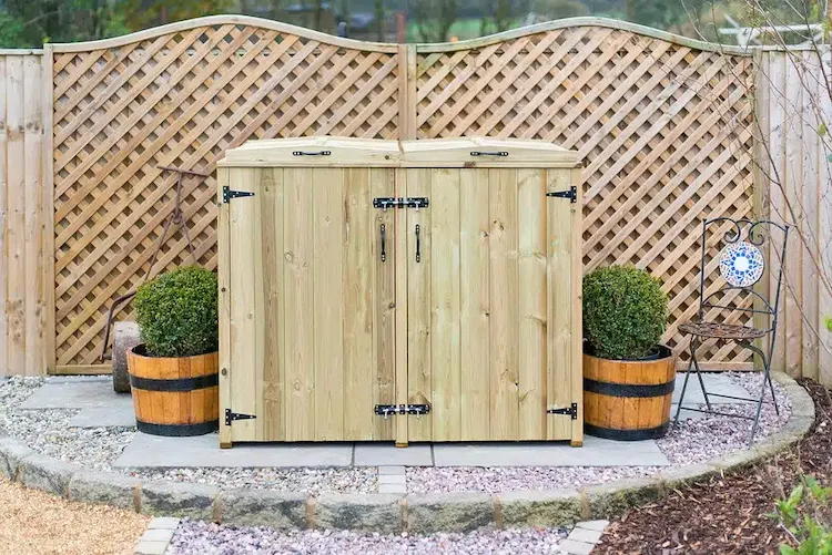 use pressure treated wood and build a stylish garbage bin box for the garden area