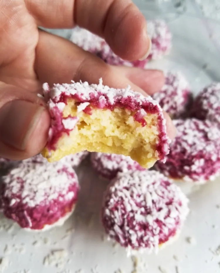 vegan raspberry zinger poke cake balls shredded coconut