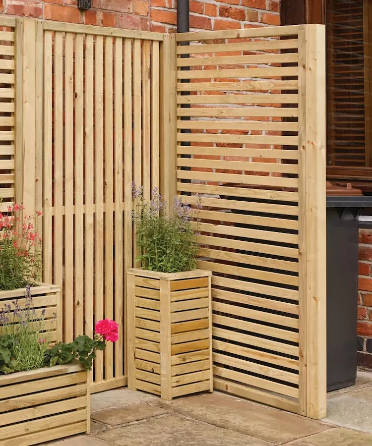 wooden slat screens can hide your garbage cans