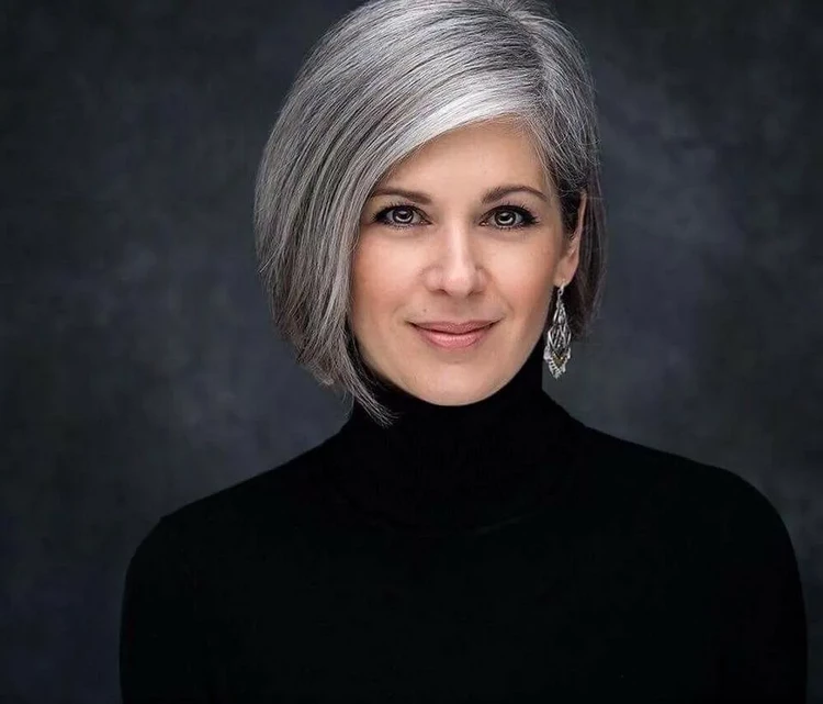 asymmetrical bob salt and pepper hair color for women over 50