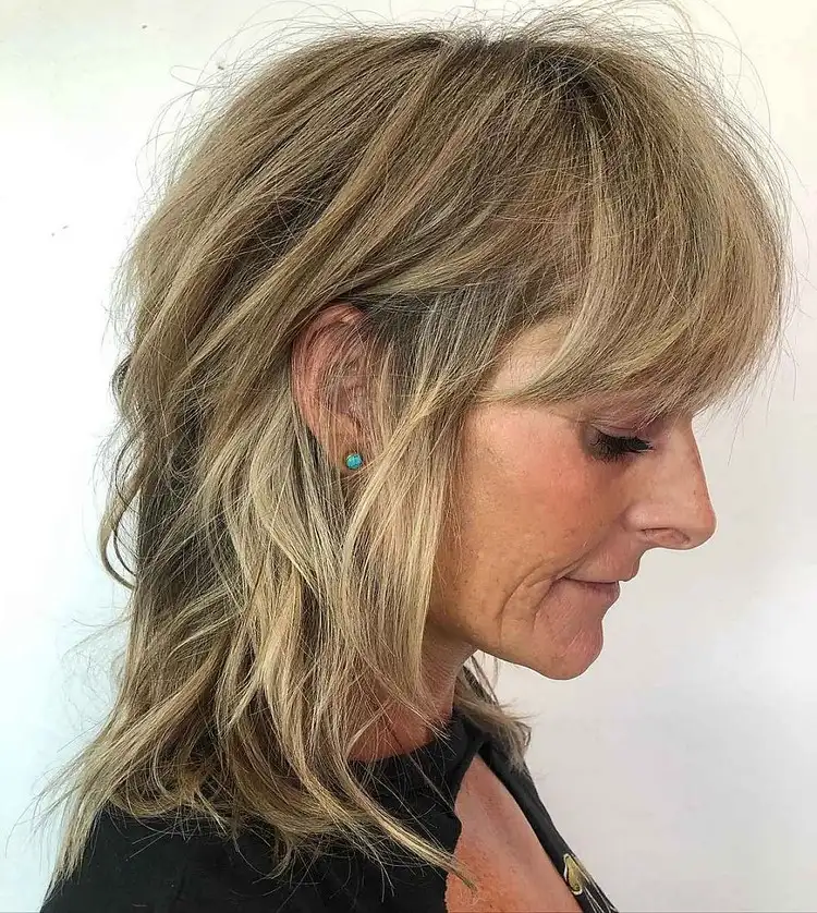 shaggy medium length bangs hairstyles for women over 60 have many textured layers