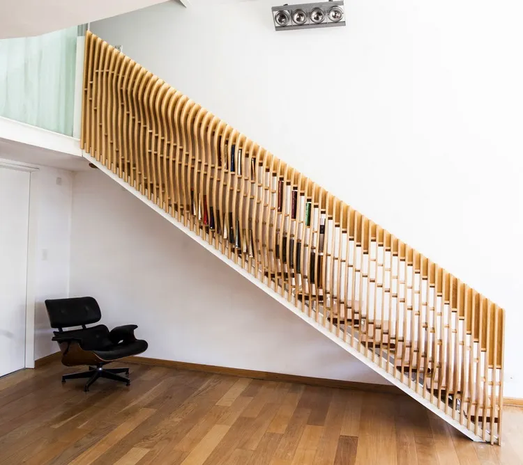 unique wooden staircase railing with book storage space