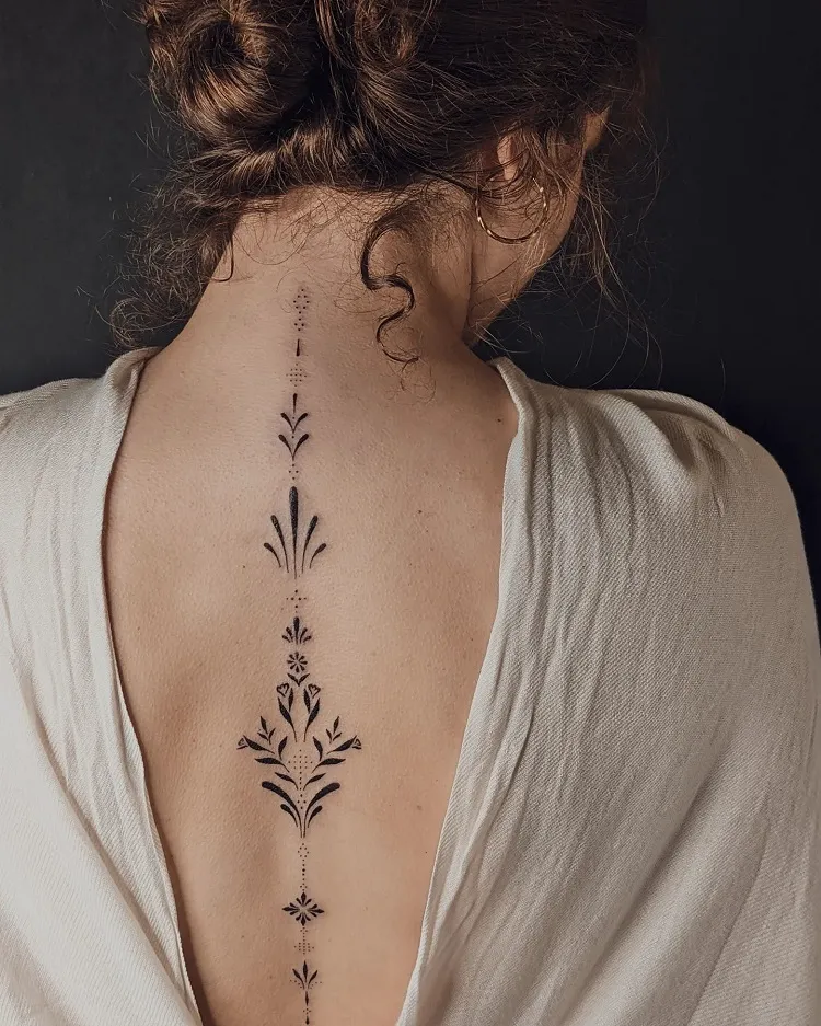 abstract ornamental minimalist spine tattoo female design idea
